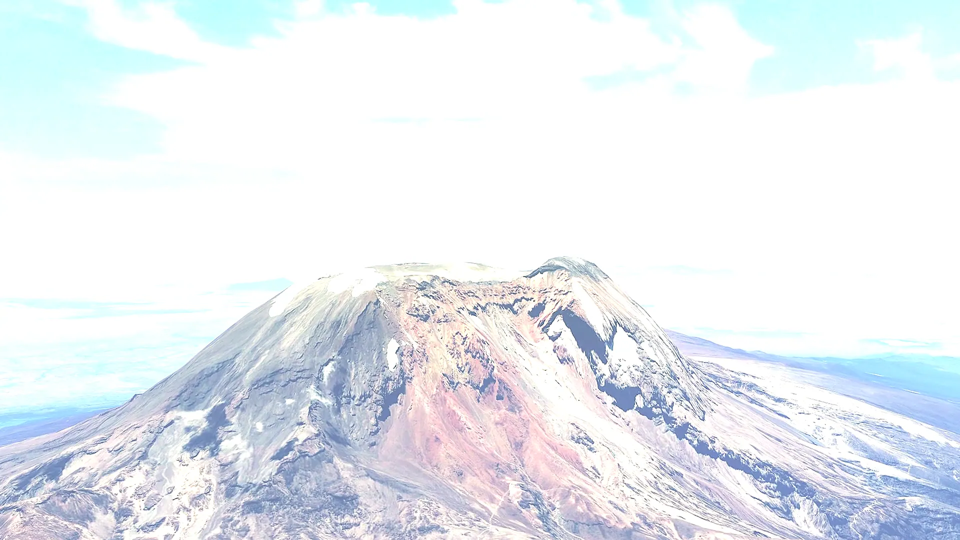 Kibo, Kilimanjaro's summit cone, close up from the air with snow in the crater